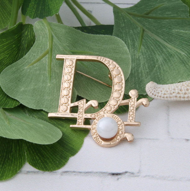 D!0R Brooch